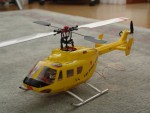 Hacker Brushless Antrieb B20-18L und Master Heli Regler. Heckmotor Brushless Direct Drive. Auf den Bildern noch nicht zu sehen sind die inzwischen eingebauten Positions-LEDs und die Antikollisions Blitz-LEDs.

Heli fliegt bisher sehr gut (Indoor), ich warte derzeit auf sch�neres Wetter drau�en. 
